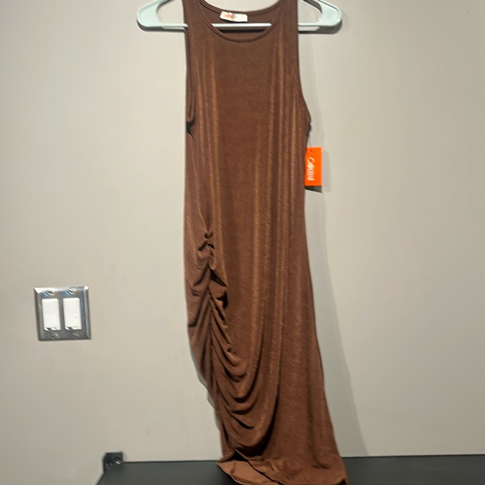 INTEMPO defines eye-catching style with this women's asymmetrical tank dress.